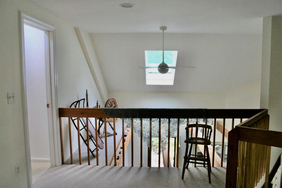 171 Monument Road Orleans, MA 02653 - Photo 21 of 47 a view of a hallway with wooden floor and stairs
