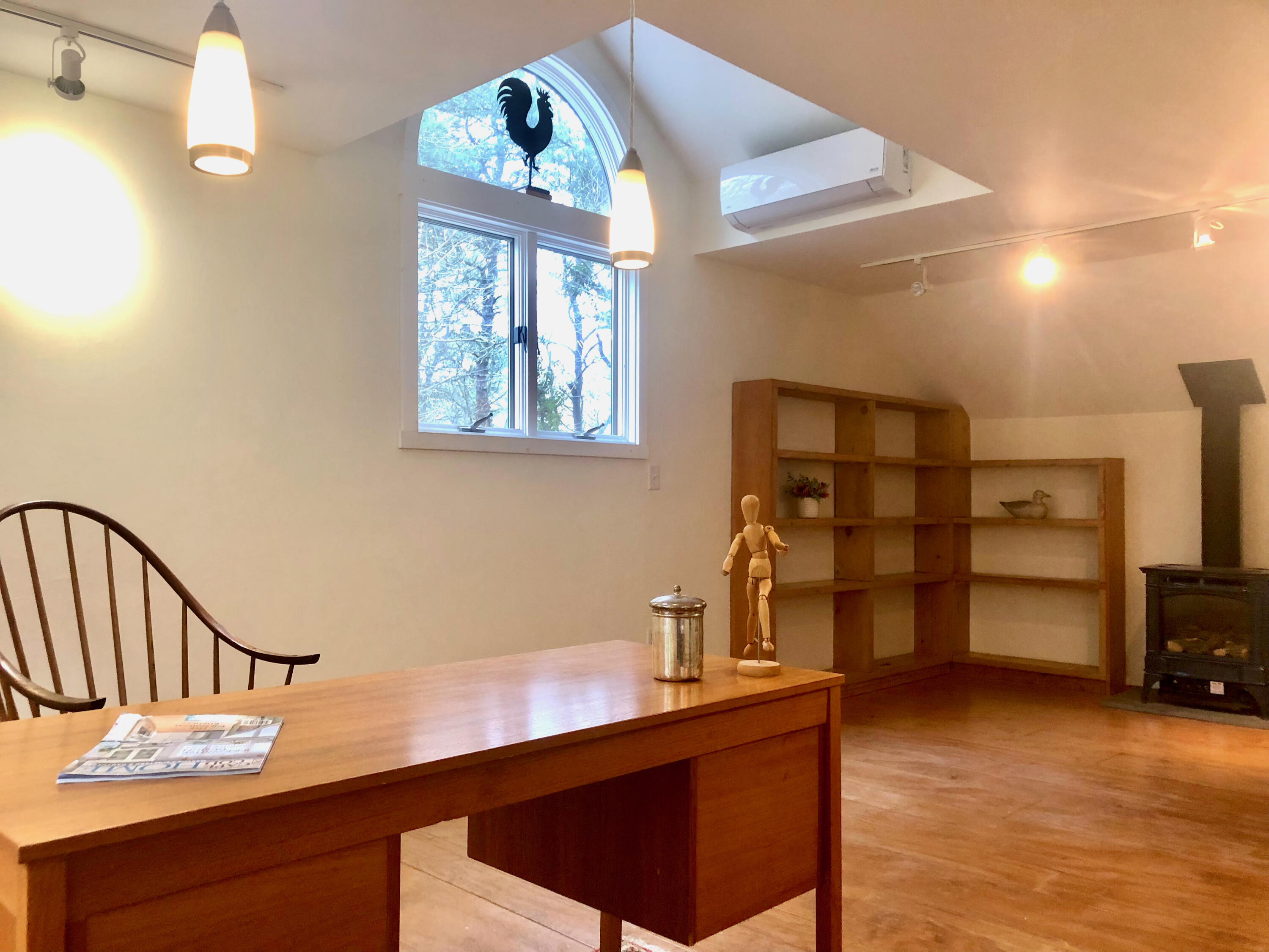 171 Monument Road Orleans, MA 02653 - Photo 25 of 47 a view of a hallway to room with wooden floor and staircase