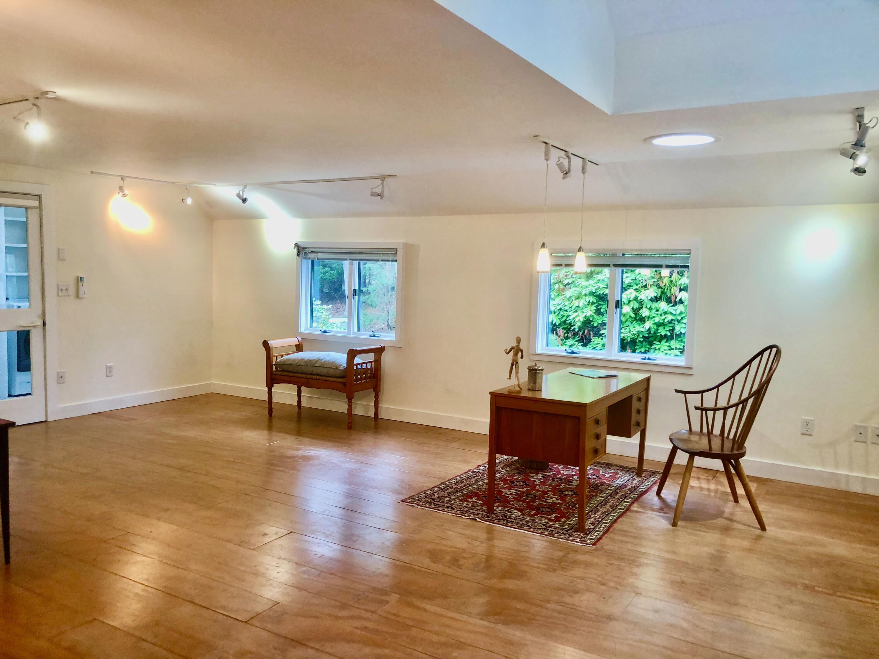 171 Monument Road Orleans, MA 02653 - Photo 28 of 47 a living room with dining room and wooden floor