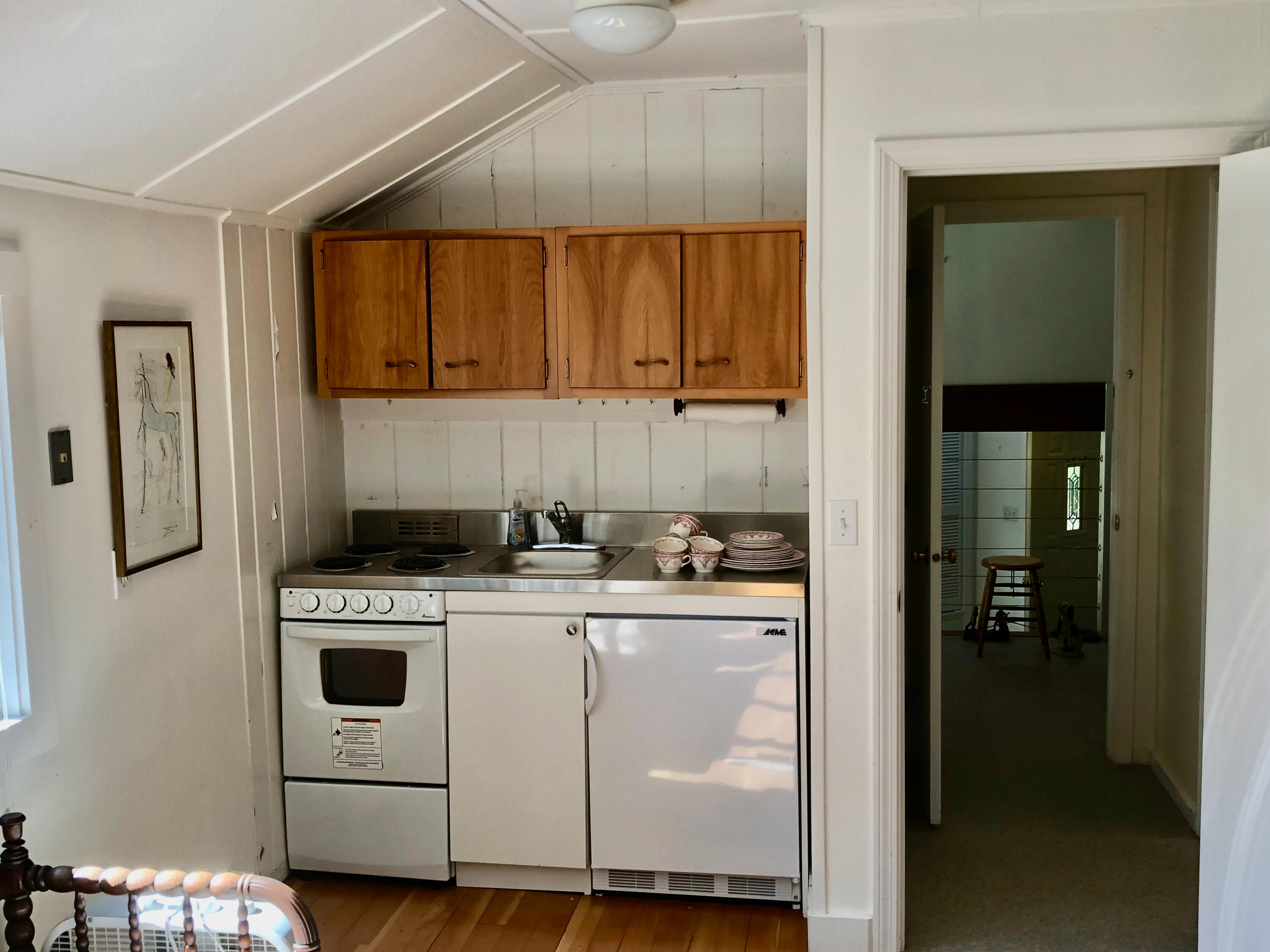 171 Monument Road Orleans, MA 02653 - Photo 31 of 47 a kitchen with a stove a refrigerator and a sink