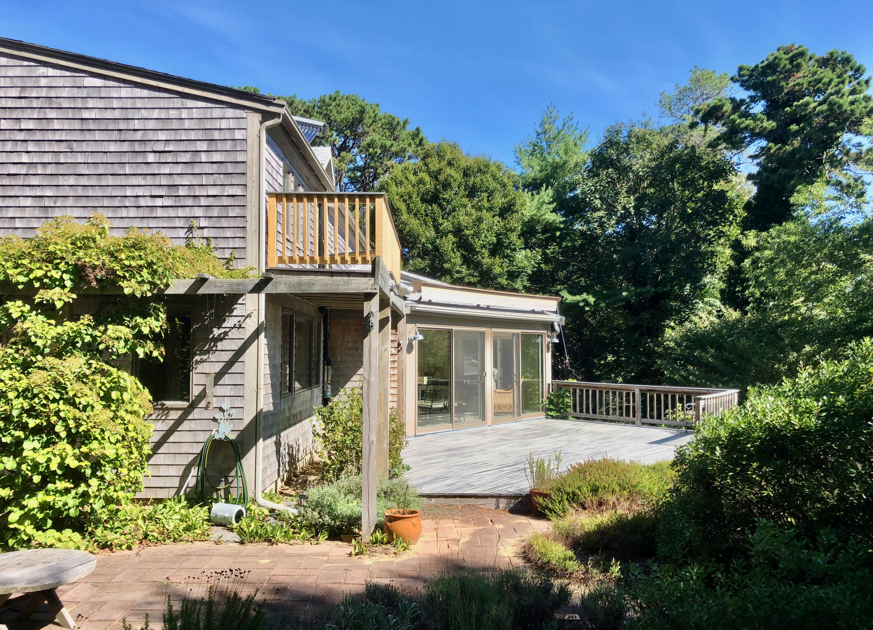 171 Monument Road Orleans, MA 02653 - Photo 36 of 47 a front view of a house with a garden