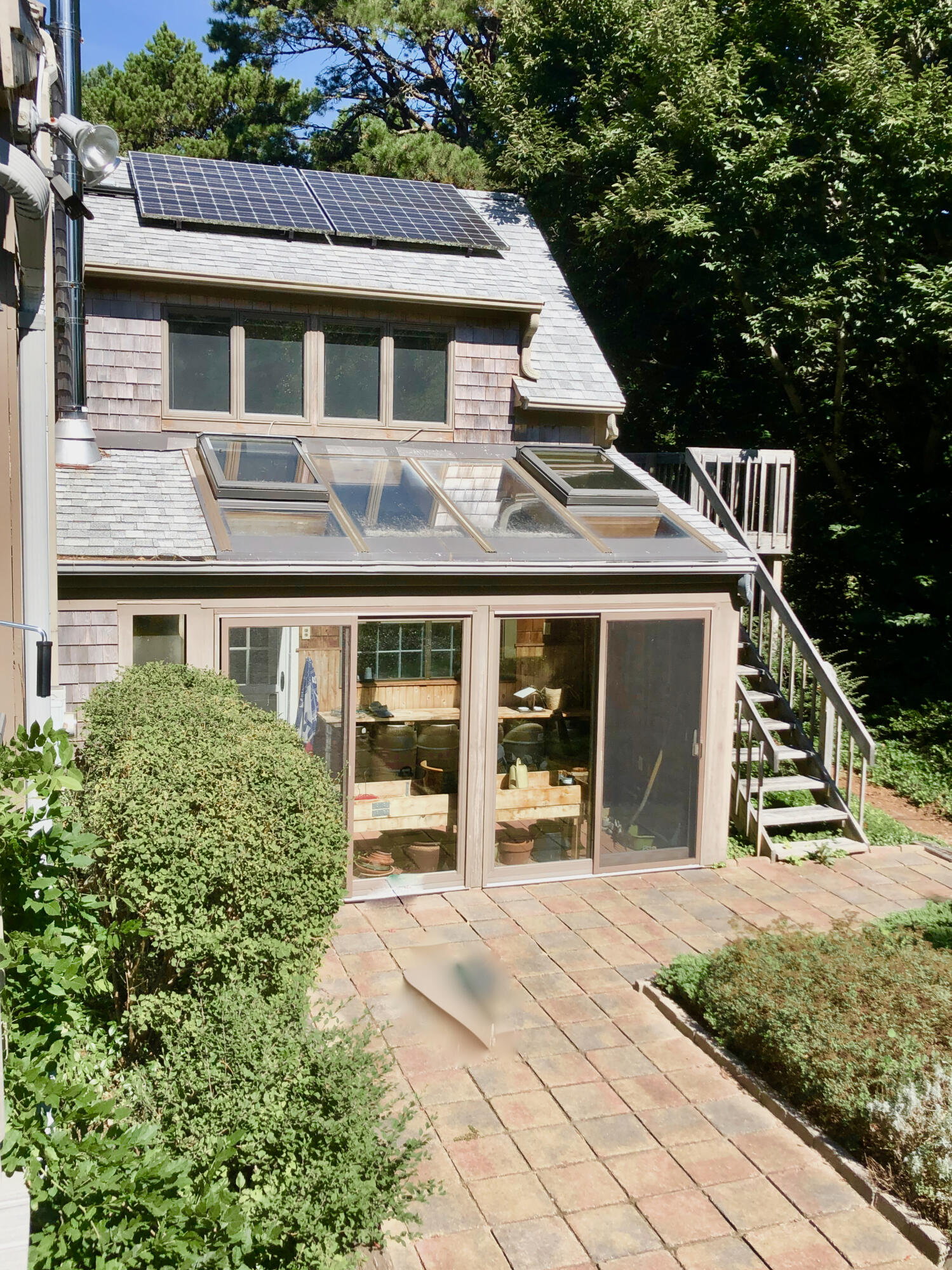 171 Monument Road Orleans, MA 02653 - Photo 38 of 47 a front view of a house with a yard and potted plants