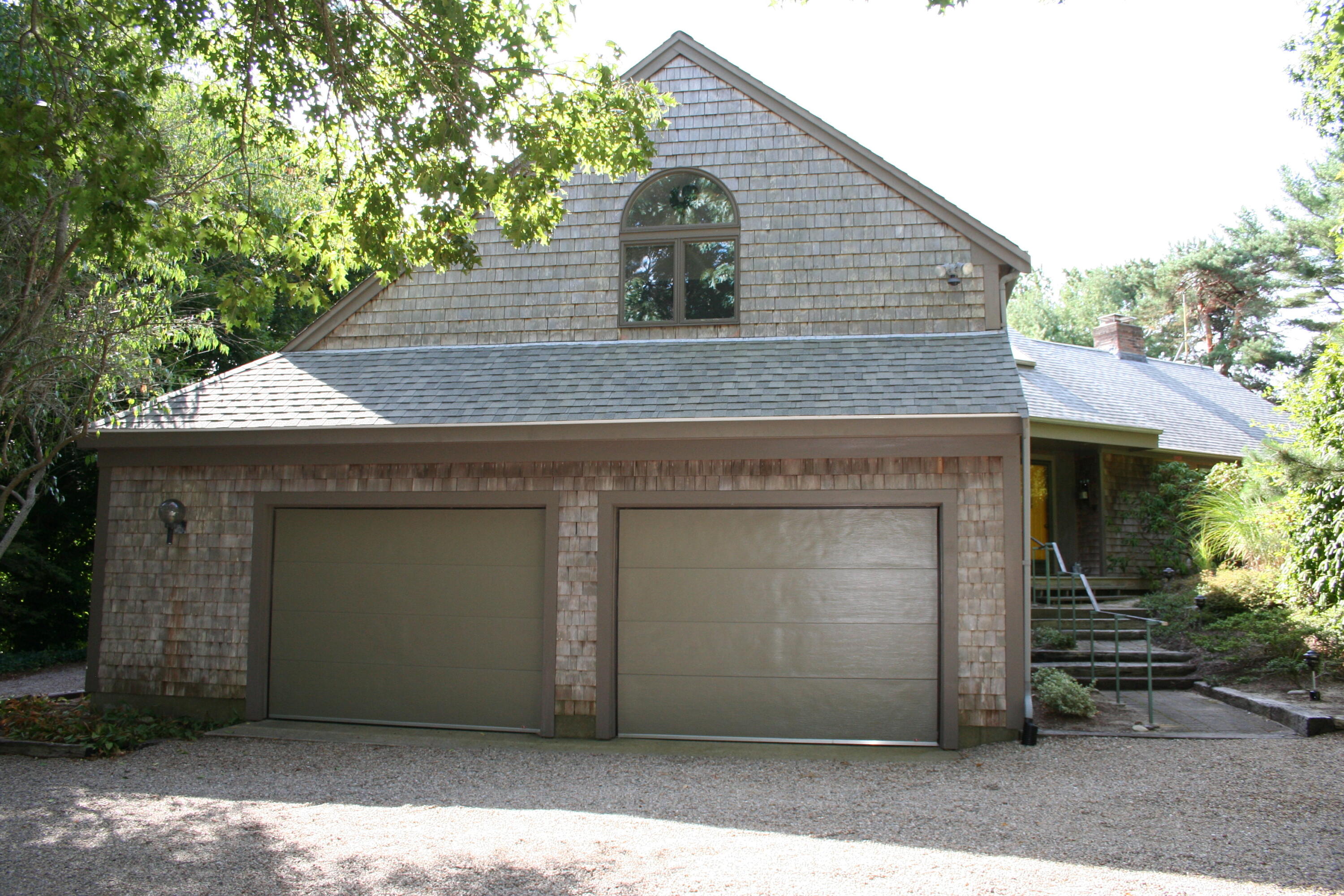 171 Monument Road Orleans, MA 02653 - Photo 43 of 47 a front view of a house with garage