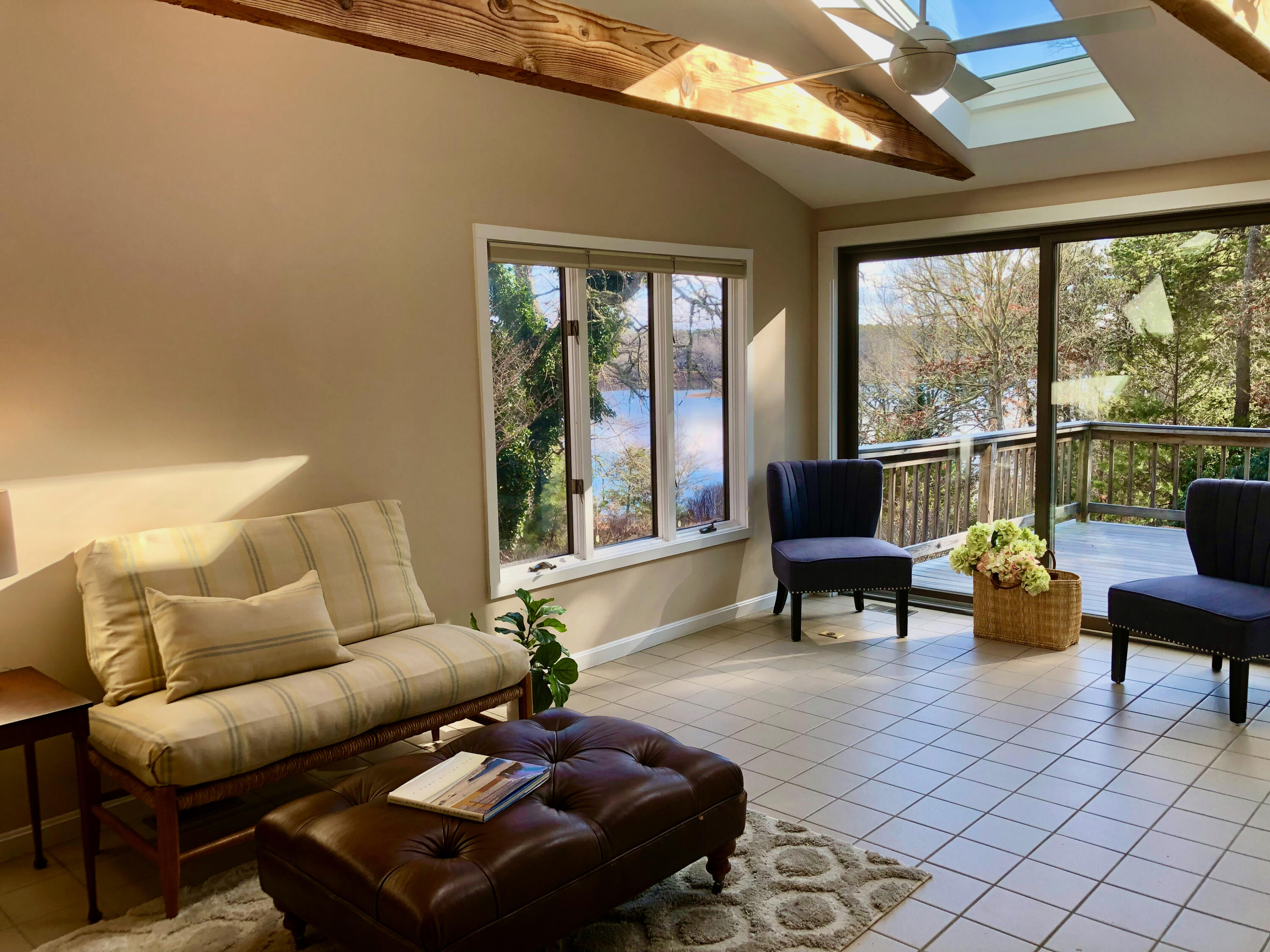 171 Monument Road Orleans, MA 02653 - Photo 5 of 47 a living room with furniture and a large window