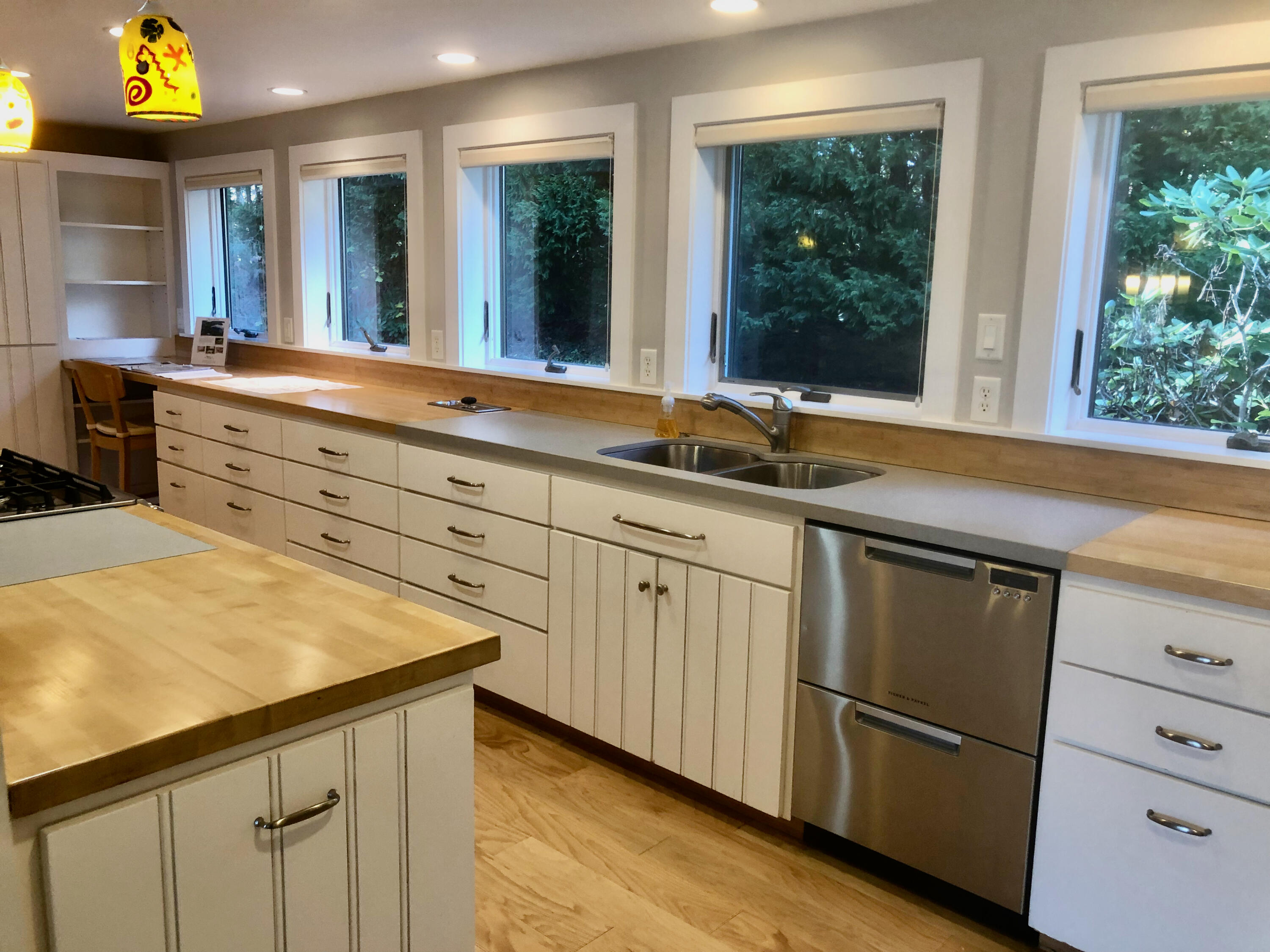 171 Monument Road Orleans, MA 02653 - Photo 9 of 47 a kitchen with stainless steel appliances granite countertop a sink and wooden cabinets