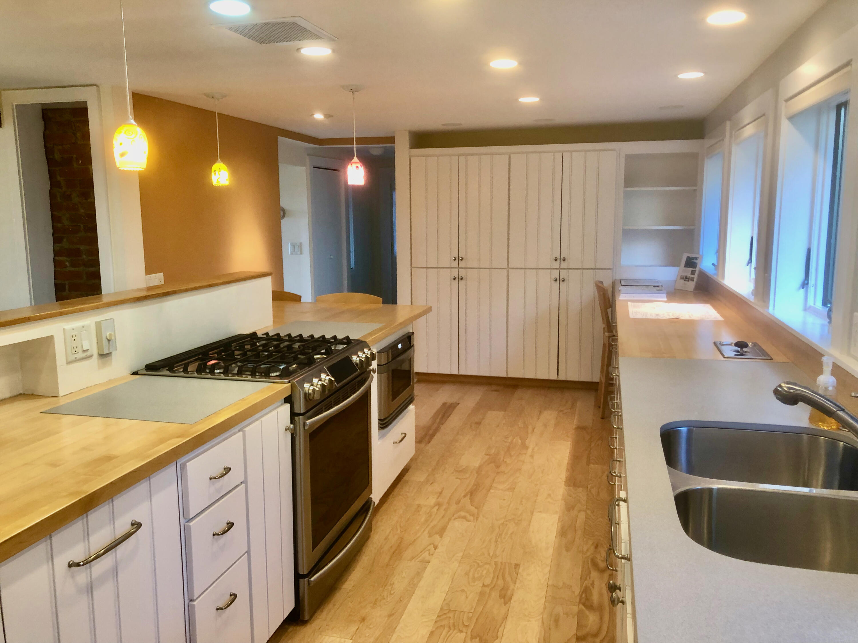 171 Monument Road Orleans, MA 02653 - Photo 10 of 47 a kitchen with stainless steel appliances granite countertop a sink stove and refrigerator