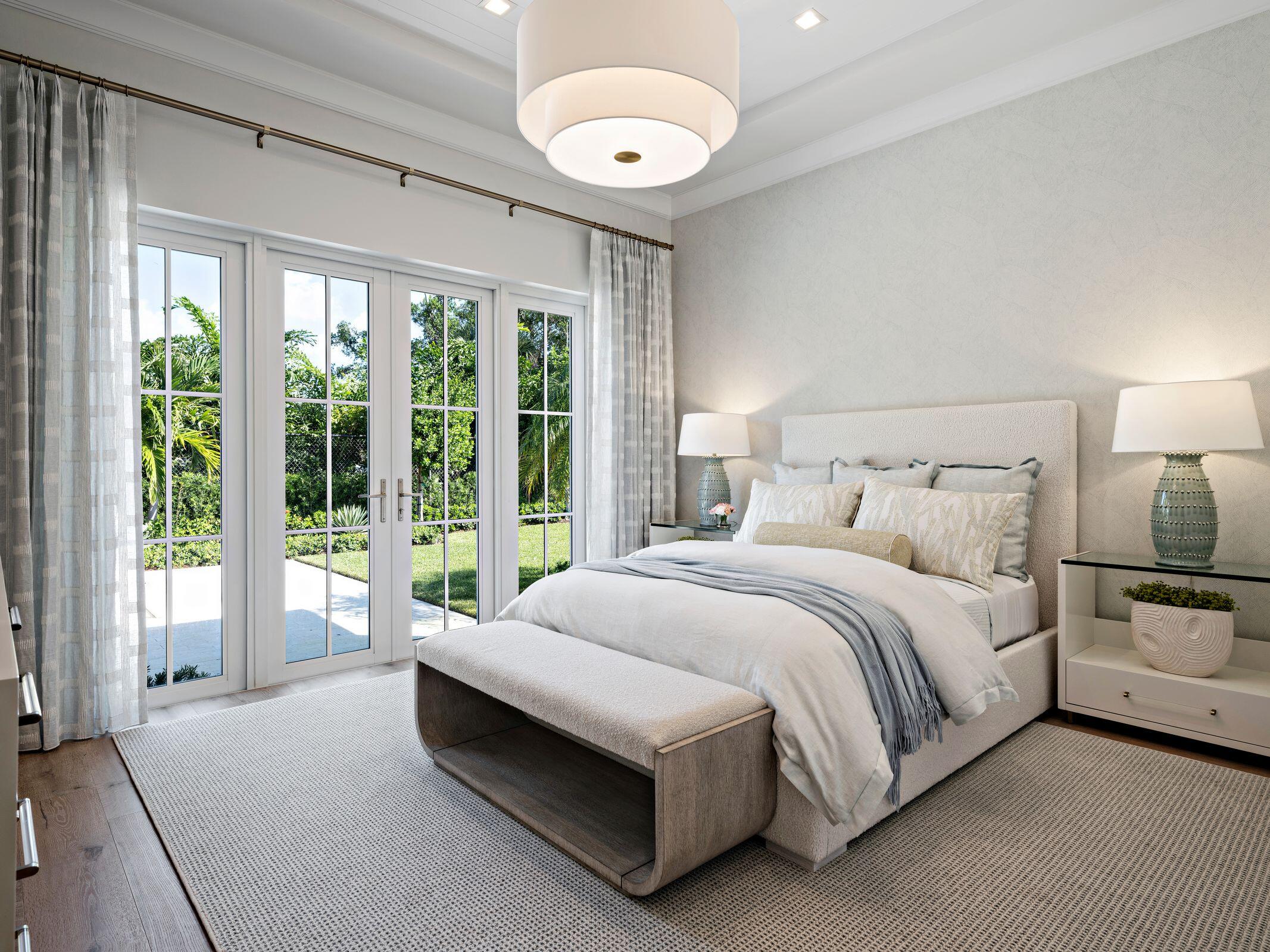 2913 Bluewater Cove Gulf Stream, FL 33483 - Photo 26 of 43 a spacious bedroom with a large bed and a large window