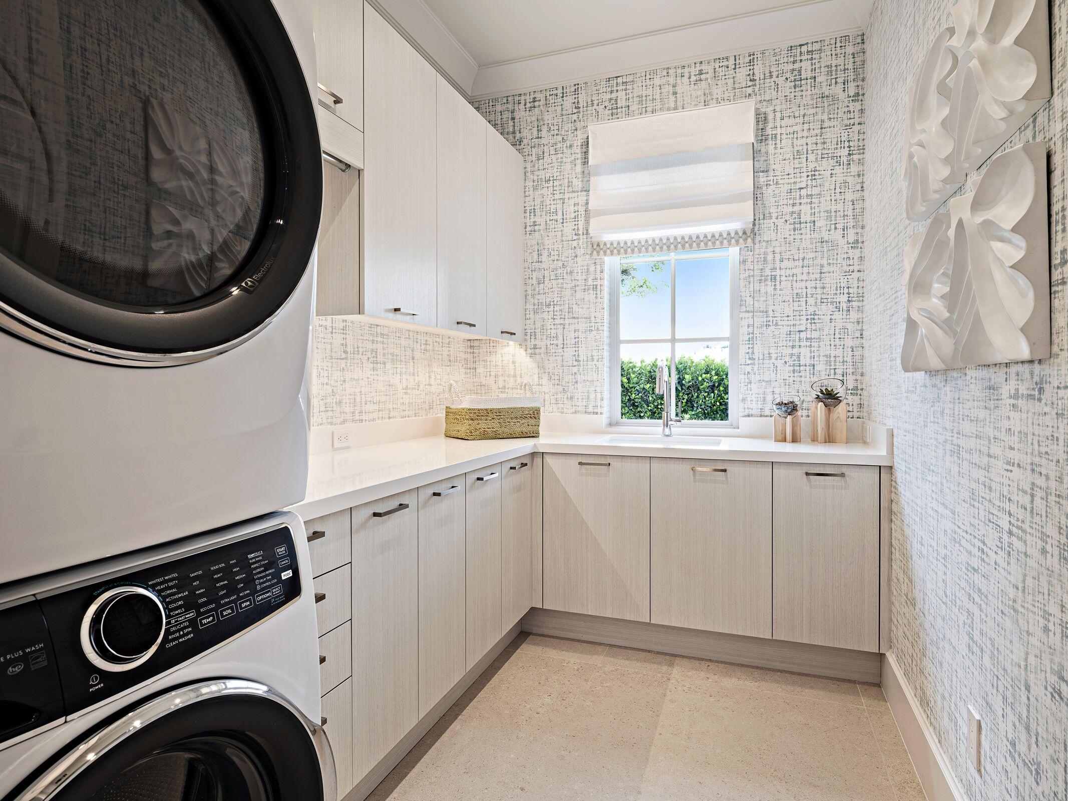 2913 Bluewater Cove Gulf Stream, FL 33483 - Photo 36 of 43 a utility room with sink dryer and washer