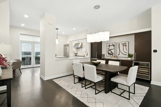 a dining room with furniture and wooden floor