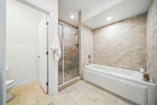 a bathroom with a bathtub and a shower