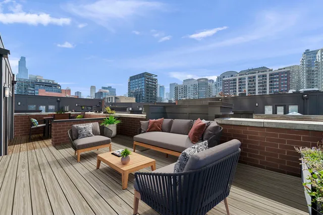 a rooftop view with patio