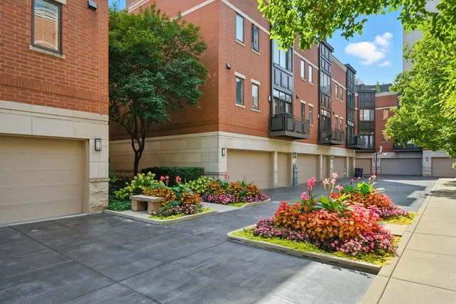 a view of a pathway with flower pots