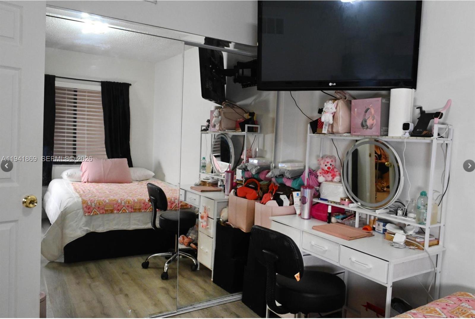 8400 Southwest 133rd Avenue Road, Unit 311 Miami, FL 33183 - Photo 8 of 11 a bedroom with a bed and a chair