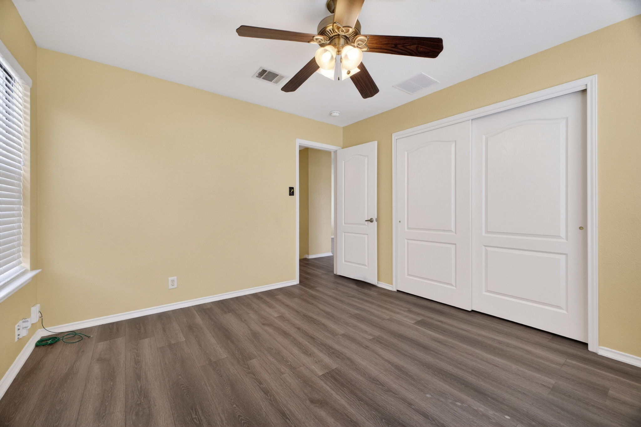 8813 Wiley Way Austin, TX 78747 - Photo 24 of 39 Second bedroom with sliding door closet and ceiling fan
