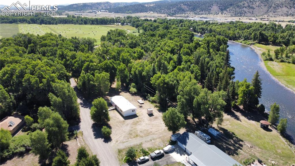 468 Rio Grande Road South Fork, CO 81154 - Photo 2 of 34 an aerial view of a house with a yard and lake view