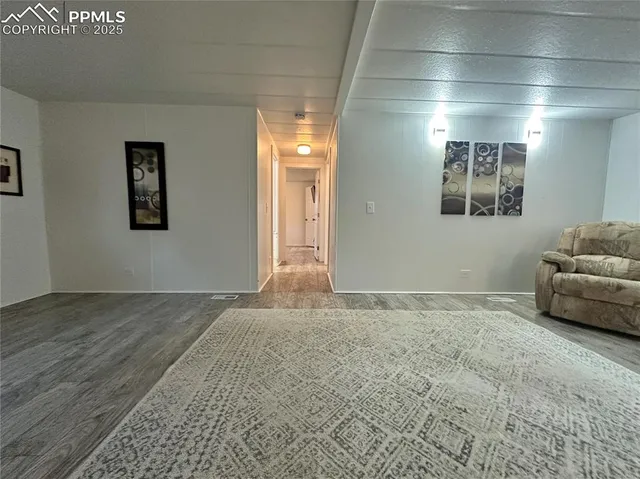 a view of livingroom with furniture and windows