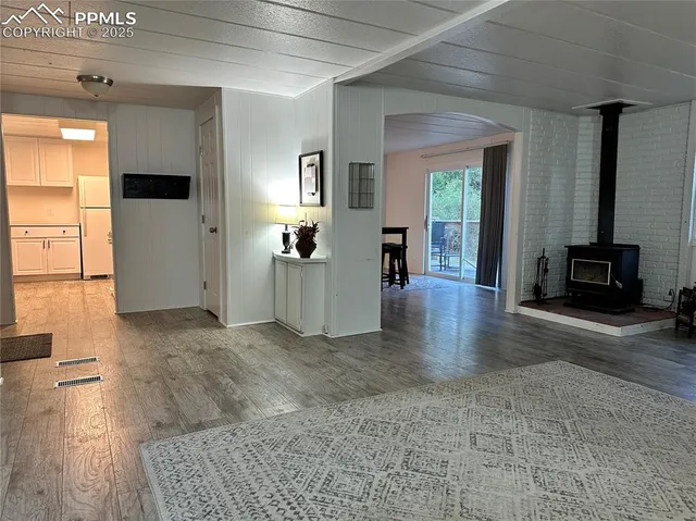 a balcony with table and chairs