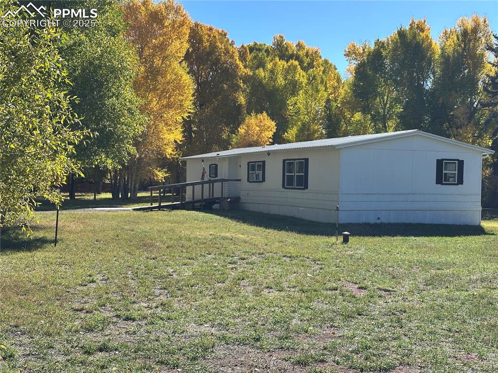 468 Rio Grande Road South Fork, CO 81154 - Photo 32 of 34 a view of a house with a yard