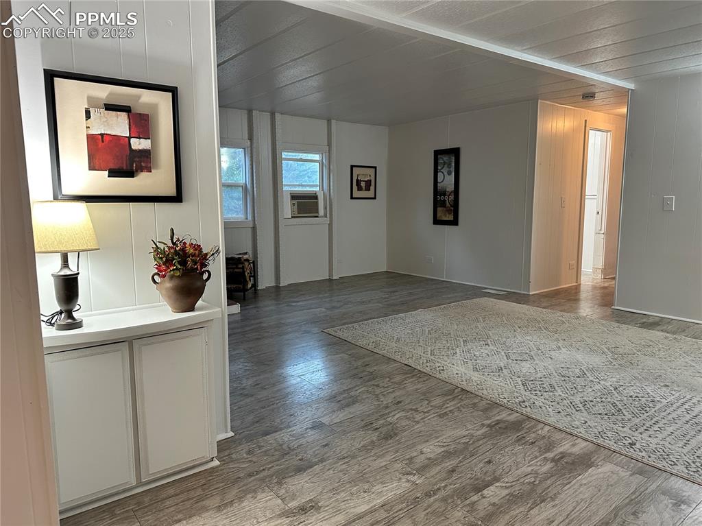468 Rio Grande Road South Fork, CO 81154 - Photo 4 of 34 a living room with stainless steel appliances kitchen island granite countertop a sink and wooden floors
