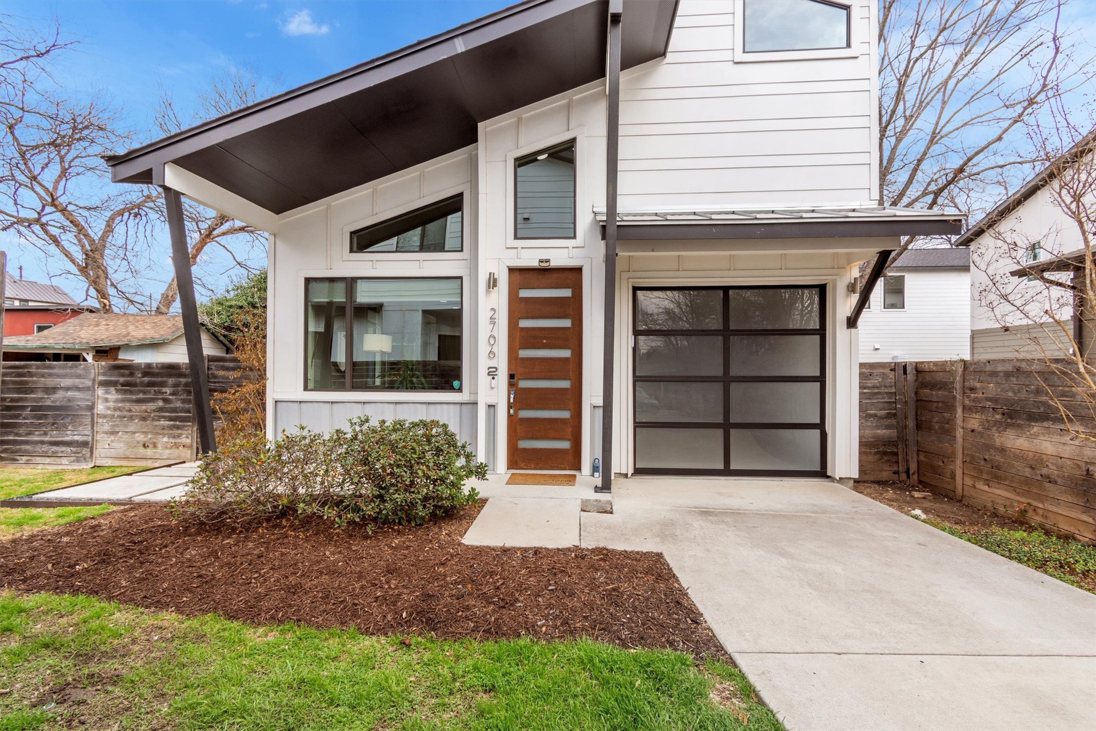 Bold modern architecture with striking black-and-white contrast and standout curb appeal.