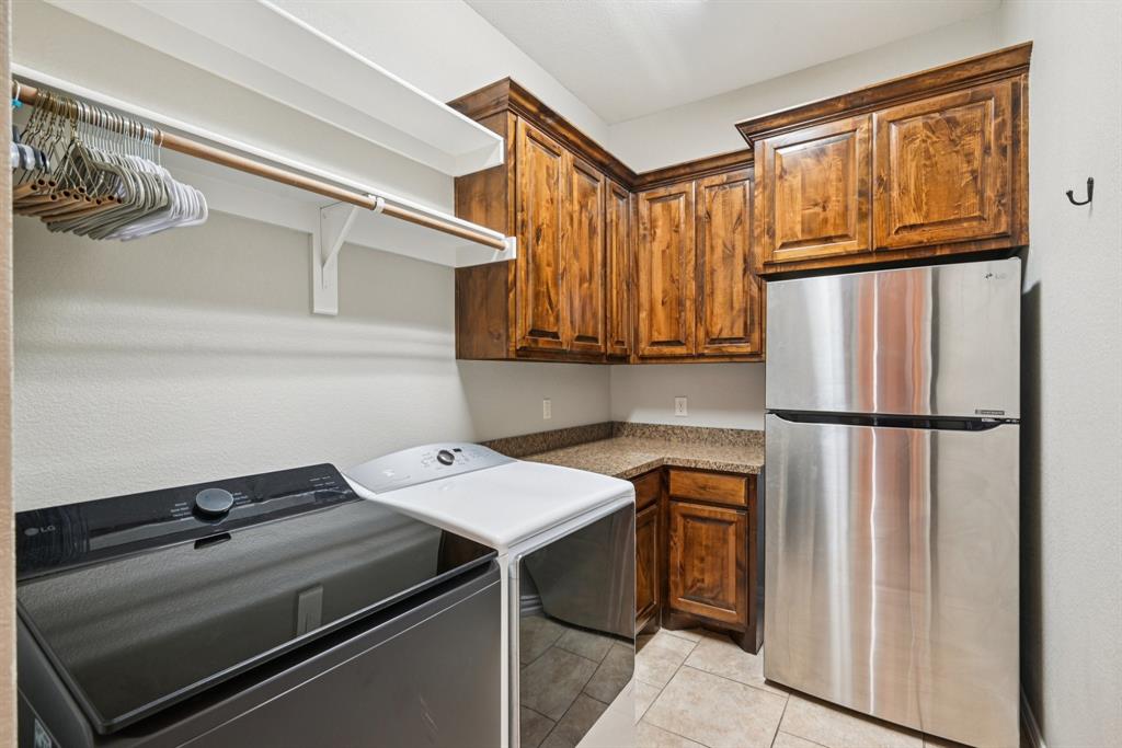 101 Maral Lane Azle, TX 76020 - Photo 11 of 36 a kitchen with appliances a sink and cabinets