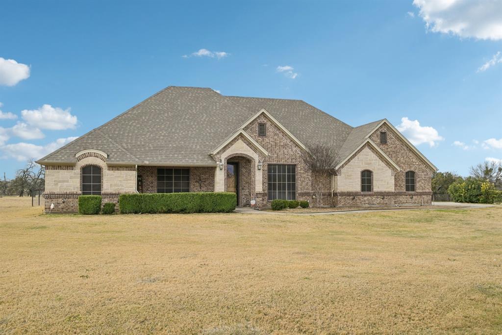 101 Maral Lane Azle, TX 76020 - Photo 2 of 36 a view of house with yard and in front of it
