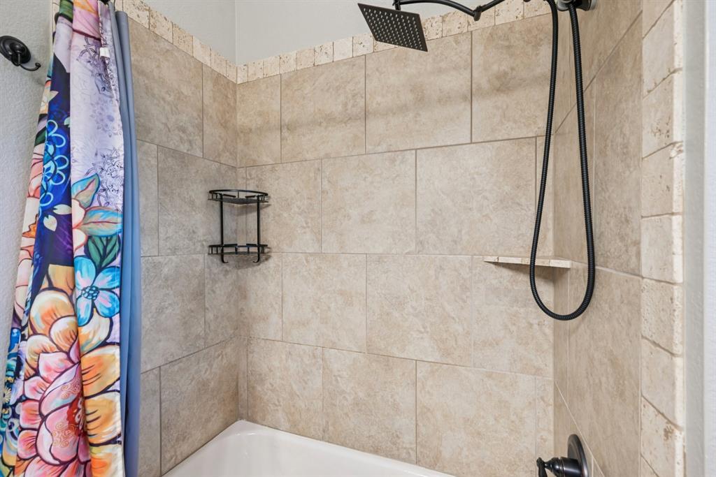 101 Maral Lane Azle, TX 76020 - Photo 22 of 36 a bathroom with a shower
