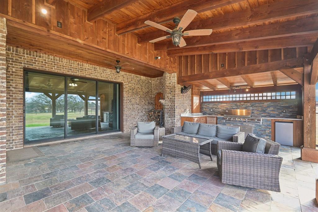 101 Maral Lane Azle, TX 76020 - Photo 26 of 36 a building outdoor space with patio furniture and potted plants