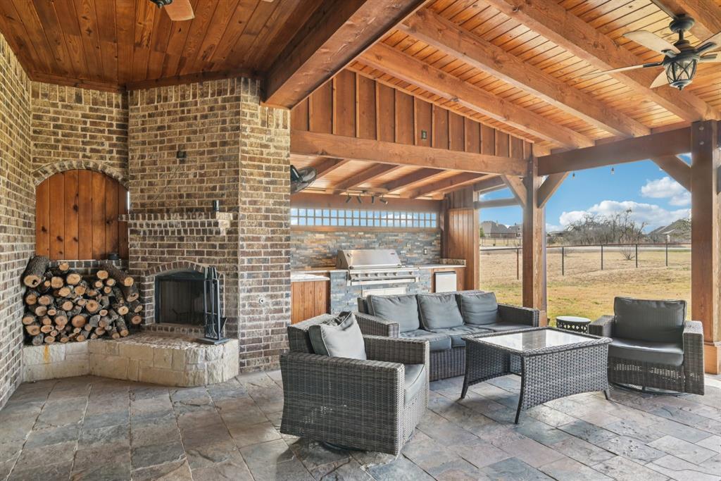 101 Maral Lane Azle, TX 76020 - Photo 27 of 36 a balcony with furniture and a fireplace