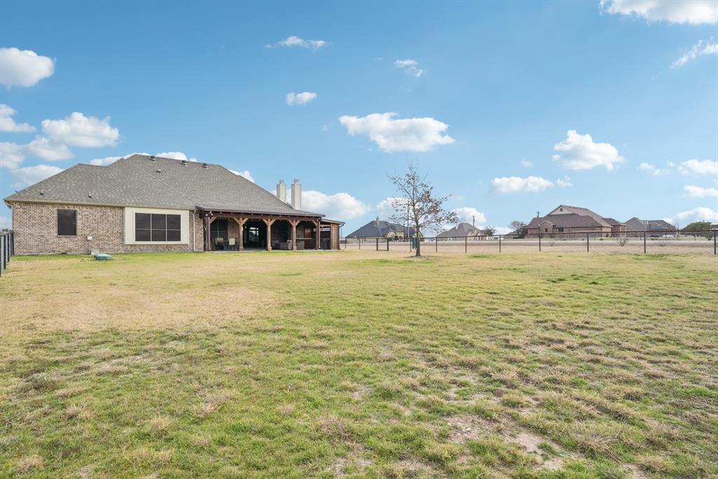 101 Maral Lane Azle, TX 76020 - Photo 30 of 36 a view of a house with swimming pool and a yard