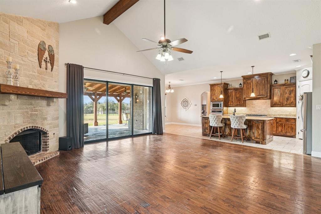 101 Maral Lane Azle, TX 76020 - Photo 6 of 36 a view of a livingroom with furniture ceiling fan and window