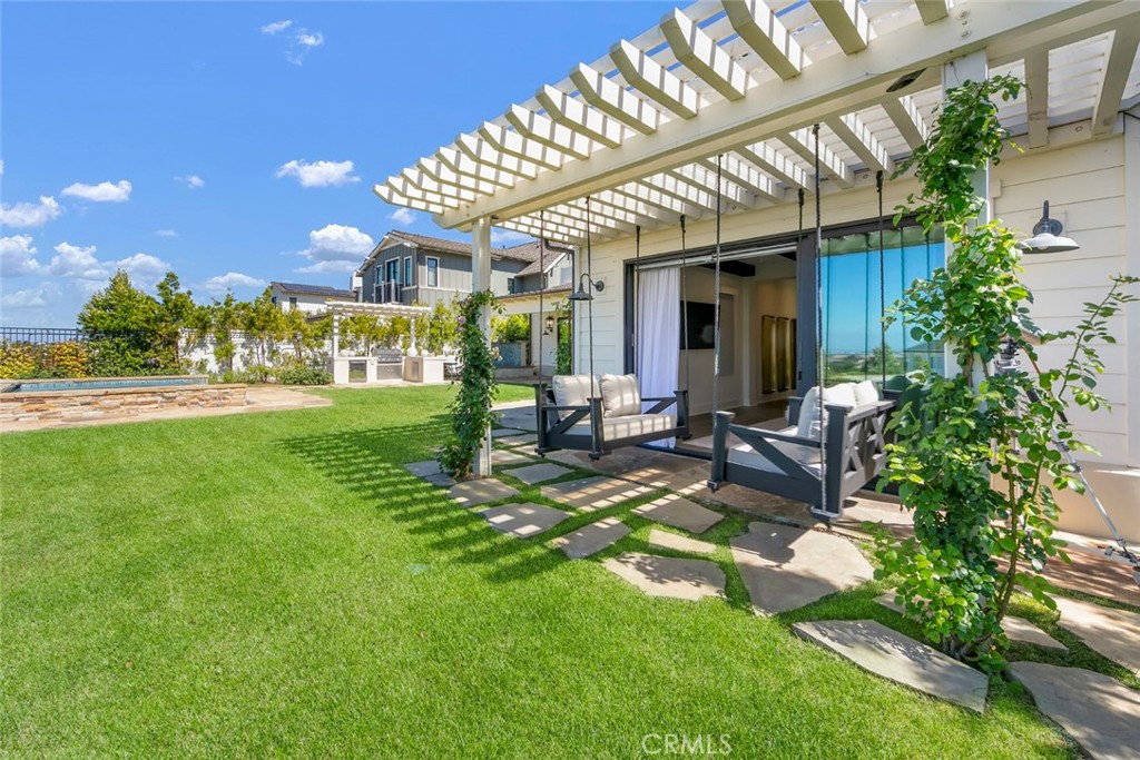 5 Rancho Elastico Road Rolling Hills Estates, CA 90274 - Photo 24 of 48 a view of a patio with table and chairs and potted plants