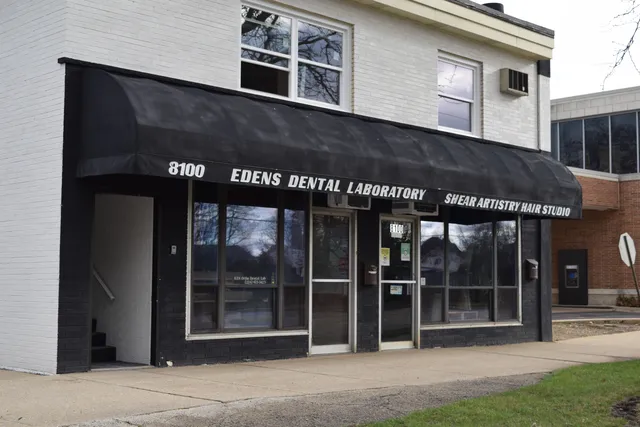 a black and white building with a large windows