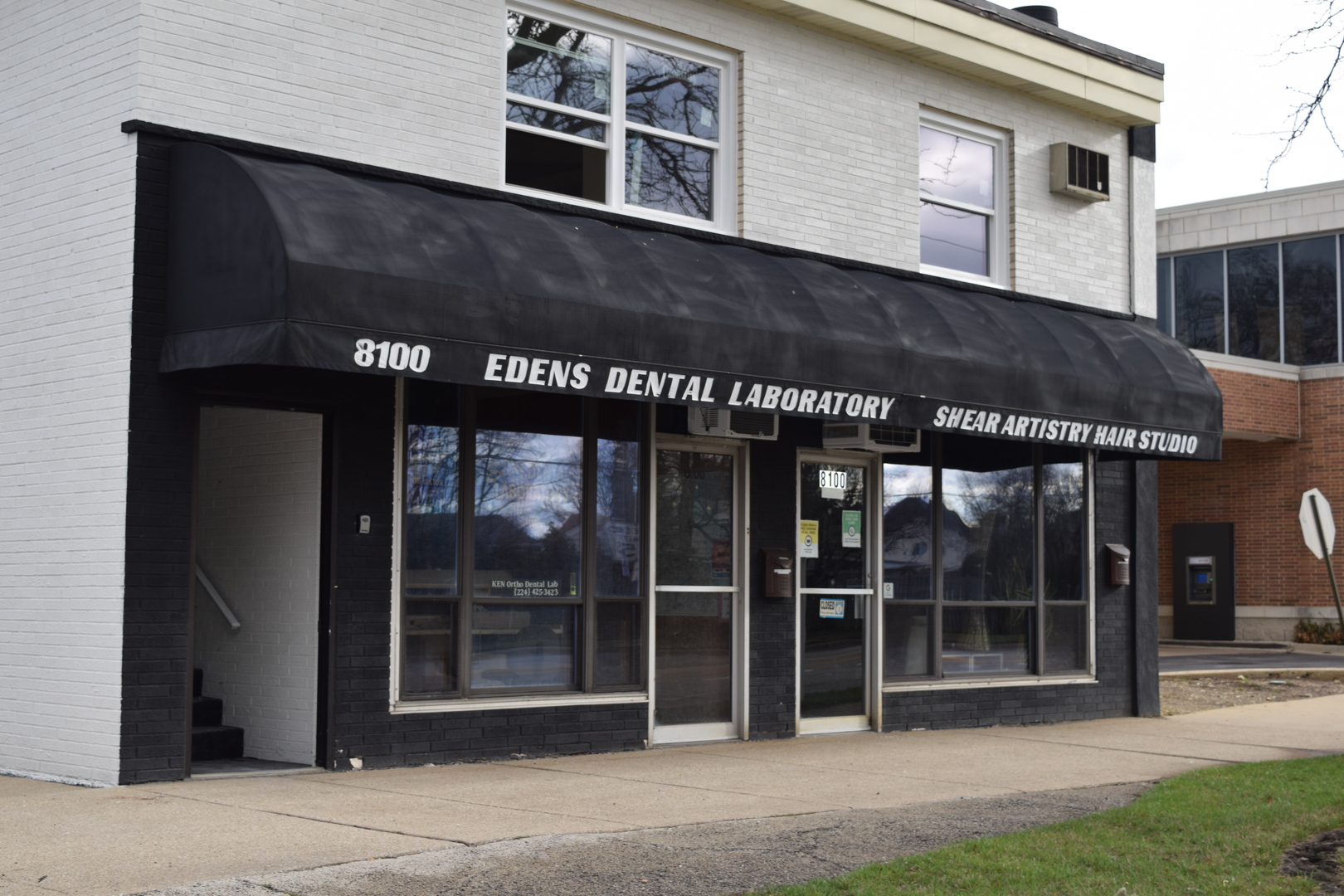 a black and white building with a large windows