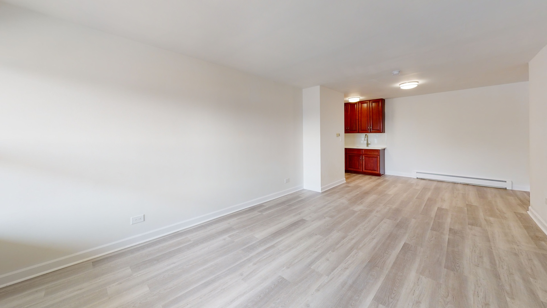 8100 Oakton Street, Unit 203 Niles, IL 60714 - Photo 11 of 15 a view of empty room with wooden floor