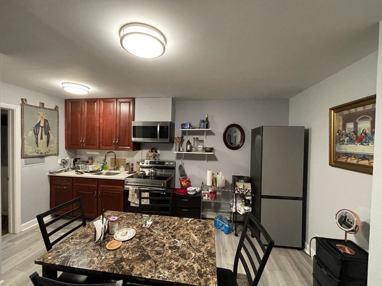 8100 Oakton Street, Unit 203 Niles, IL 60714 - Photo 2 of 15 a kitchen with a refrigerator and a stove top oven