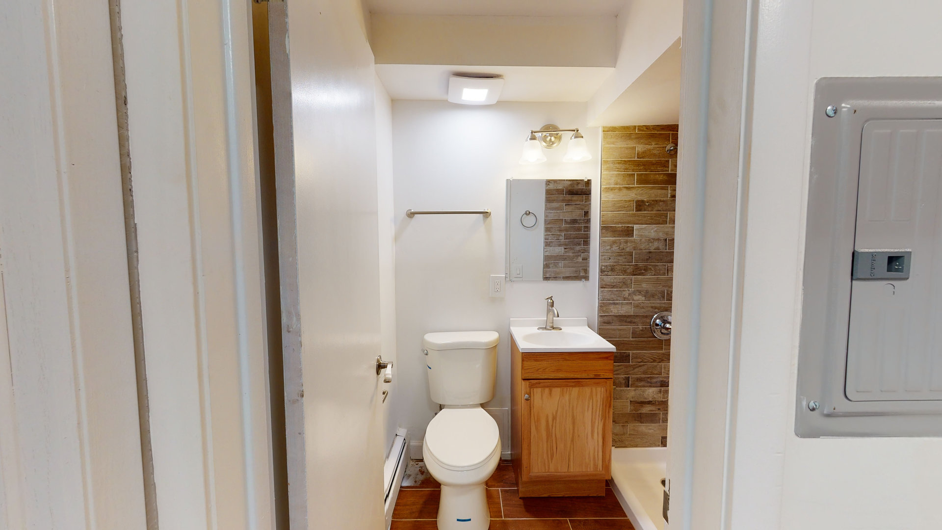 8100 Oakton Street, Unit 203 Niles, IL 60714 - Photo 4 of 15 a bathroom with a toilet and a sink