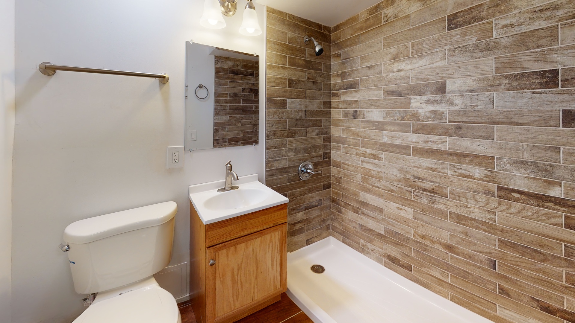 8100 Oakton Street, Unit 203 Niles, IL 60714 - Photo 5 of 15 a bathroom with a sink a toilet and shower