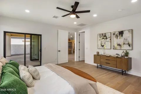 a bathroom with a double vanity sink toilet mirror and shower