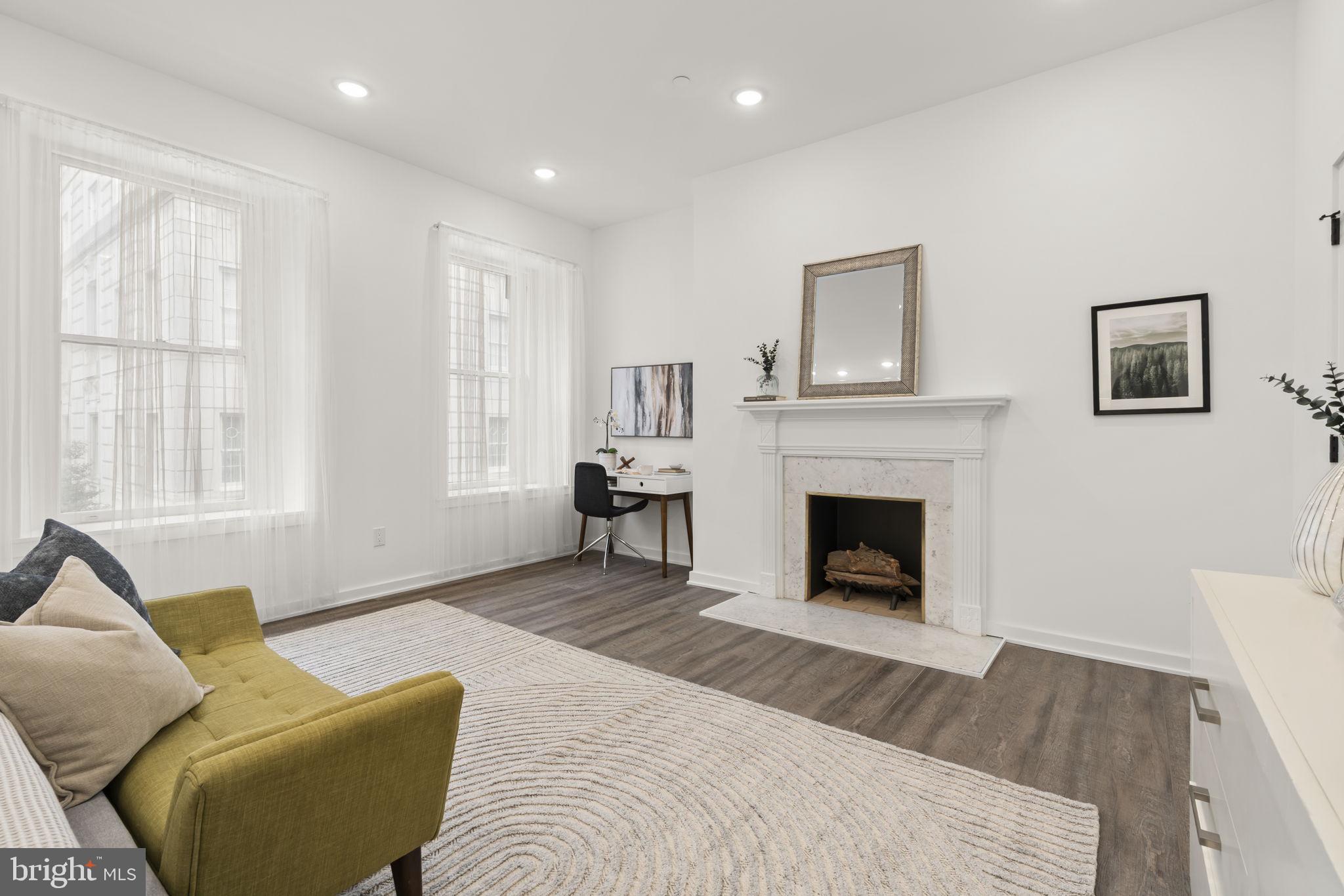 1602-4 Locust Street, Unit 202 Philadelphia, PA 19103 - Photo 14 of 25 a living room with furniture and a fireplace