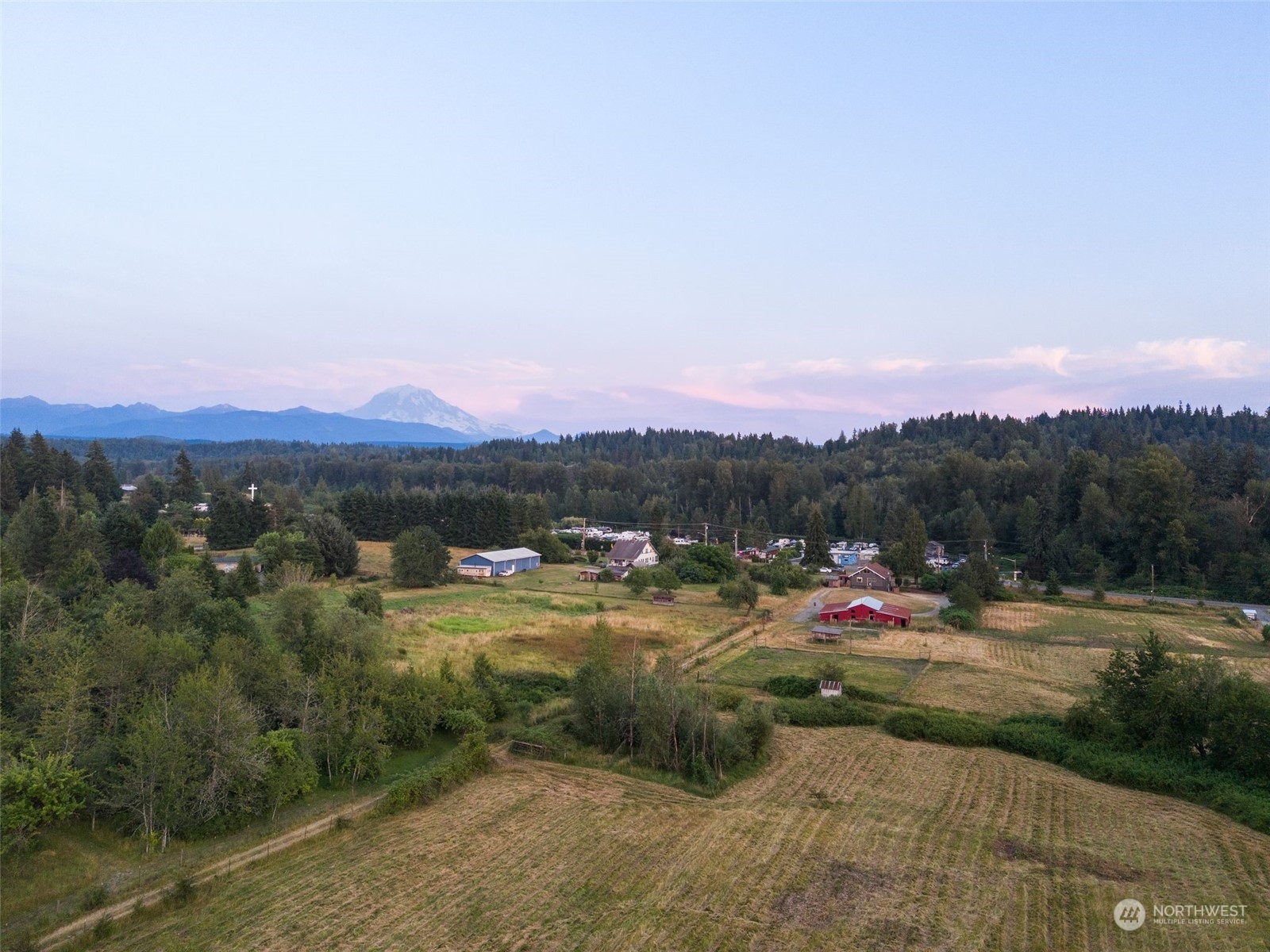 25321 South Prairie Road East Buckley, WA 98321 - Photo 31 of 35 a view of a town with mountains in the background