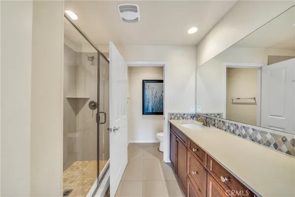 a bathroom with a double vanity sink and mirror