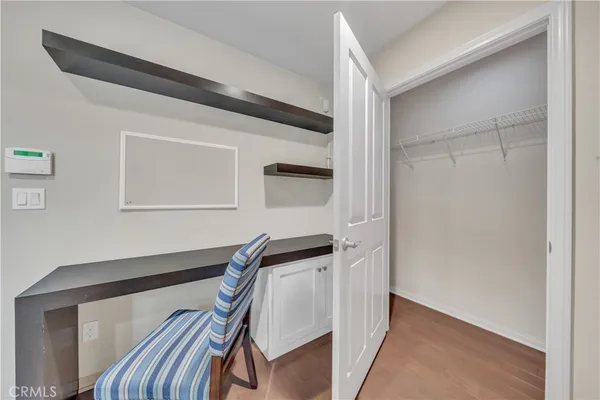 a view of an entryway with wooden floor