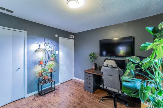 a workspace with furniture and a potted plant