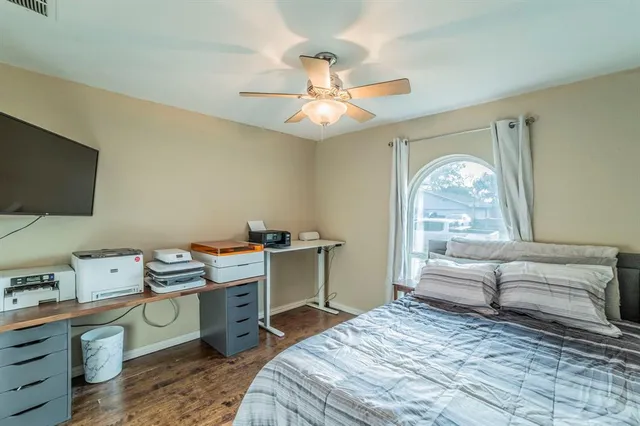 a bathroom with a granite countertop sink toilet and mirror