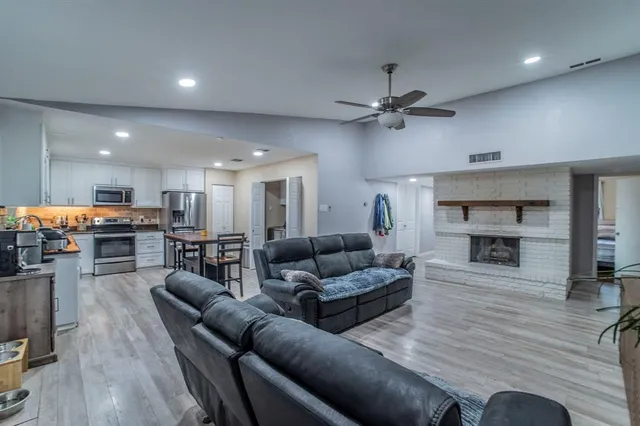a living room with furniture and a fireplace