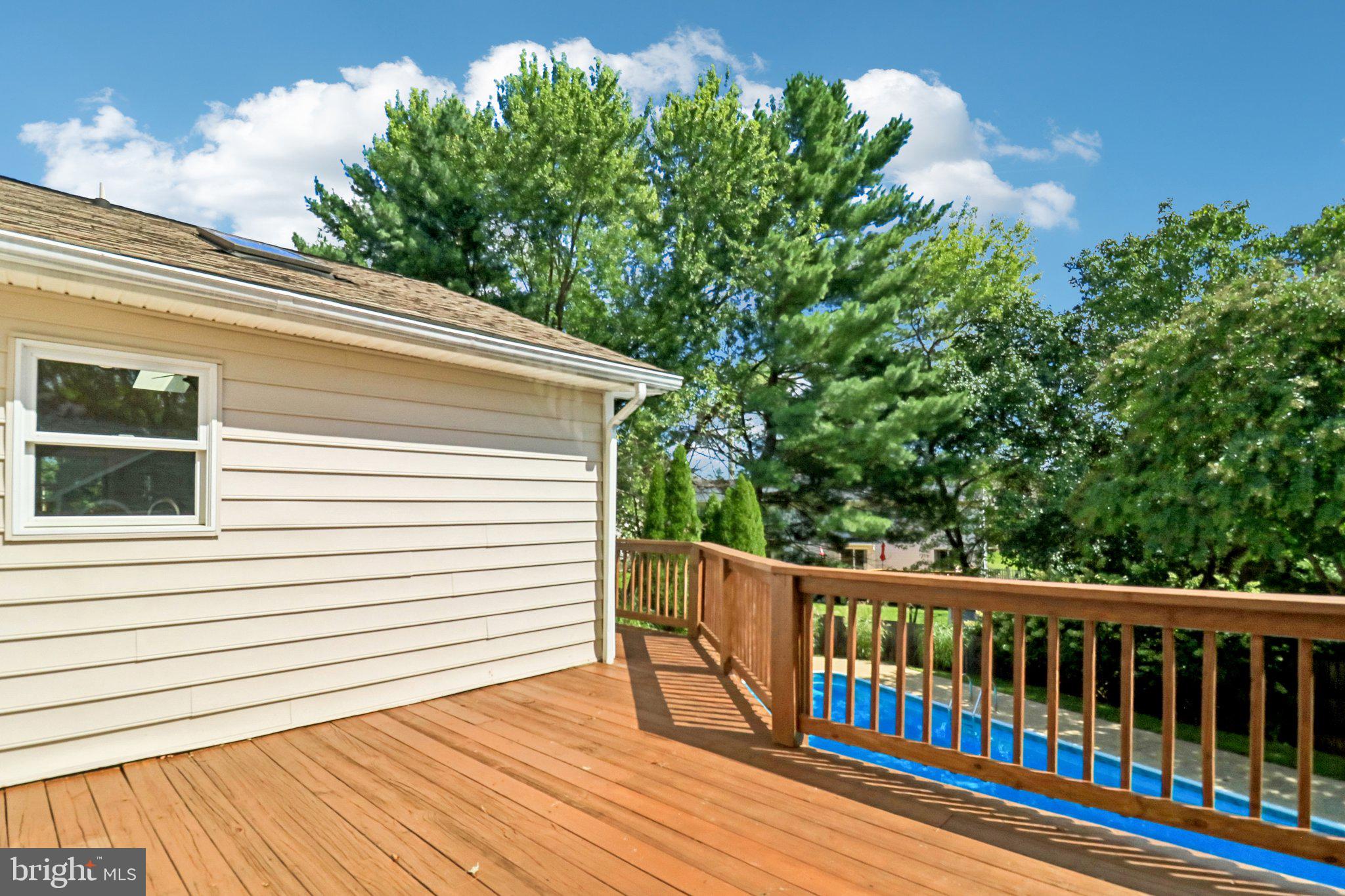 12408 Triple Crown Road Gaithersburg, MD 20878 - Photo 79 of 87 The deck wraps around the back of the house.