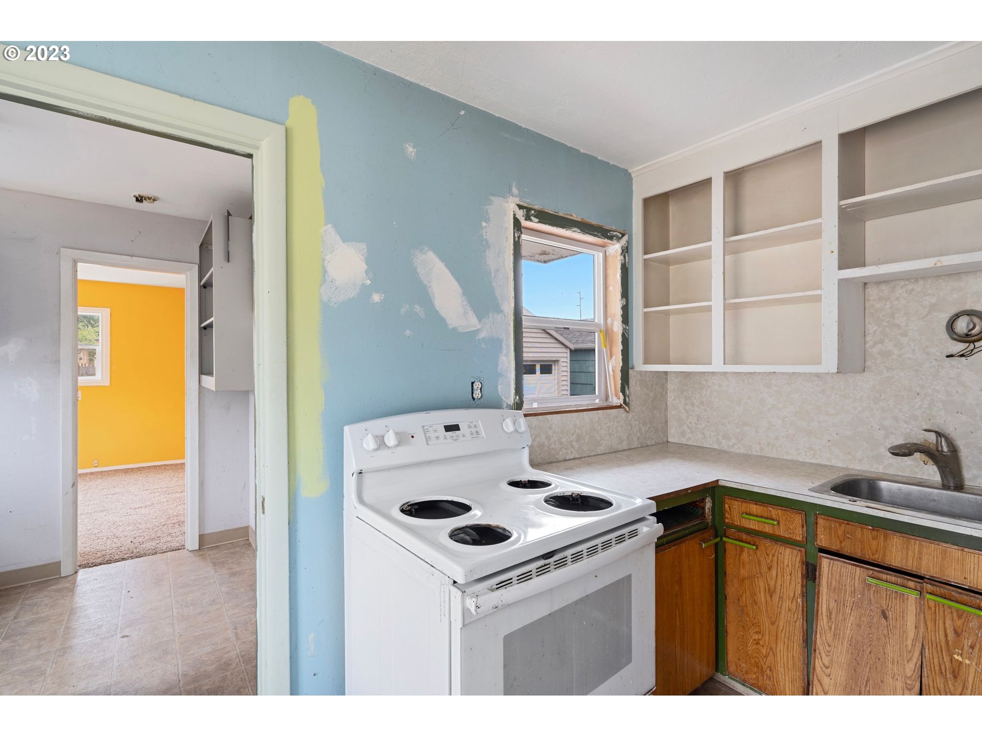 5119 Southeast 68th Avenue Portland, OR 97206 - Photo 13 of 43 a kitchen that has a sink and a stove