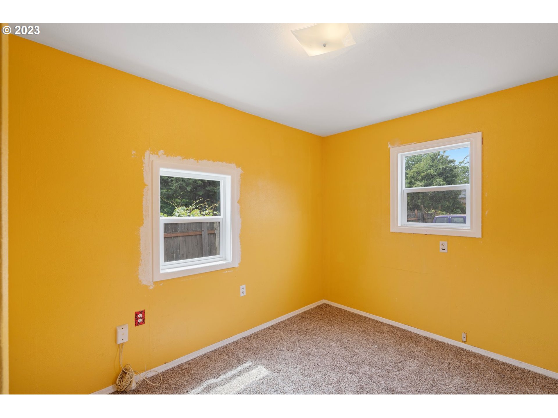 5119 Southeast 68th Avenue Portland, OR 97206 - Photo 15 of 43 a view of an empty room with a window