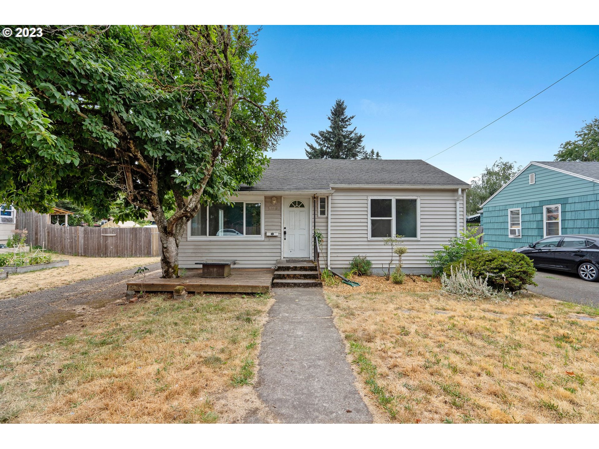 5119 Southeast 68th Avenue Portland, OR 97206 - Photo 2 of 43 a view of a house with a patio